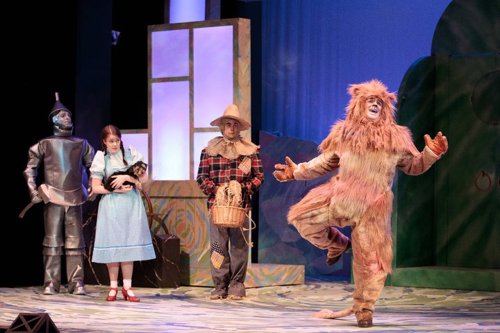 Tin Man, Dorothy, Toto, & Scarecrow watch the Lion sing